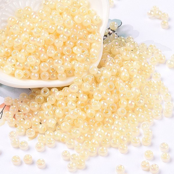 

PandaHall 6/0 Opaque Colours Rainbow Plated Round Glass Seed Beads, Moccasin, 4x3mm, Hole: 1.2mm, about 7200pcs/pound Glass Orange