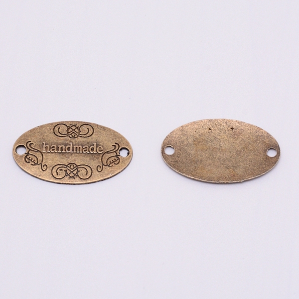 

PandaHall Tibetan Style Alloy Links, Cadmium Free & Lead Free, Oval with Word Handmade, Antique Bronze, 19x31.5x2mm, Hole: 2.5mm, 60pcs/bag...