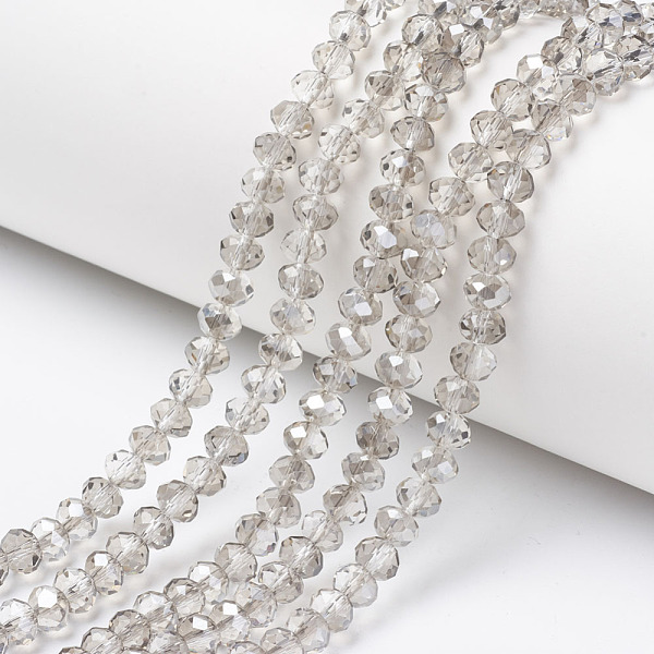 

PandaHall Electroplate Transparent Glass Beads Strands, Half Gray Plated, Faceted, Rondelle, Clear, 6x5mm, Hole: 1mm, about 85~88pcs/strand...