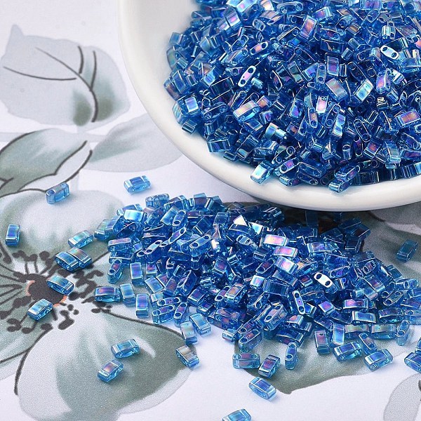 

PandaHall MIYUKI Half TILA Beads, Japanese Seed Beads, 2 Hole, (HTL291) Transparent Capri Blue AB, 5x2.3x1.9mm, Hole: 0.8mm, about..., Cyan