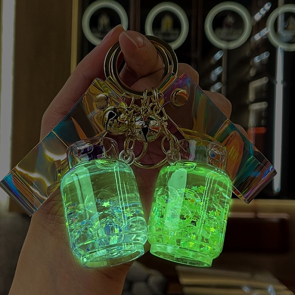 

PandaHall Acrylic Luminous Into Oil Canister Pendant Keychains, Floating Quicksand Keychains, Glow in the Dark, Light Cyan, Tank: 50x35mm...