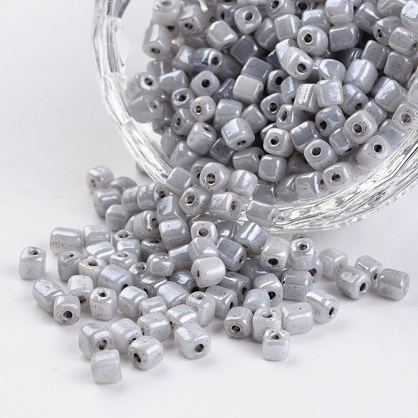 

PandaHall 6/0 Cube Ceylon Round Hole Glass Seed Beads, Gray, 3.5~4x2.5~3mm, Hole: 0.5mm, about 5500pcs/450g Glass Cube Gray