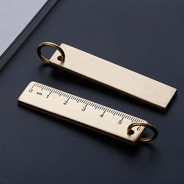 

PandaHall 6cm Sturdy Straight Brass Ruler with Key Ring, Metal Bookmark Measuring Tool, for Keychain, Golden, 65x15mm Brass