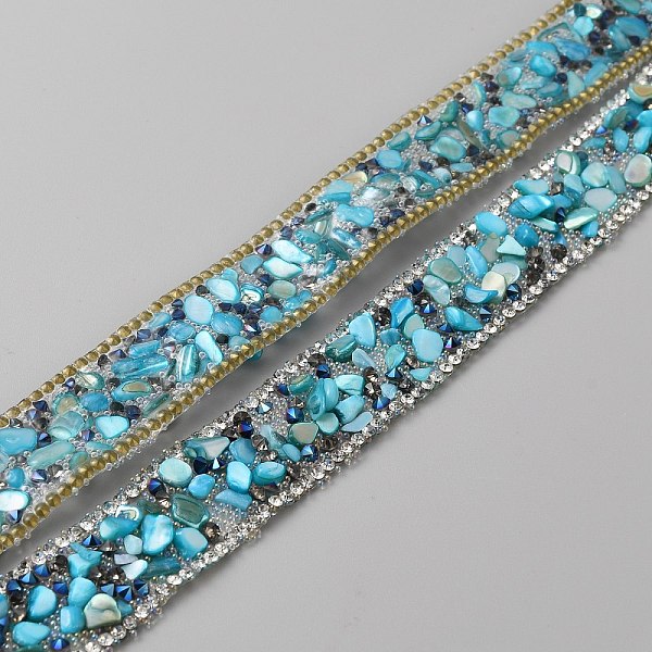 

PandaHall Hotfix Rhinestone Tape, with Stone Chip, for Costume Accessories, Belt Decoration, Deep Sky Blue, 20x4~5mm, about 50cm/pc Resin...