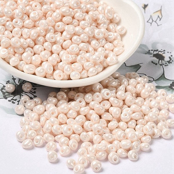 

PandaHall 6/0 Glass Seed Beads, Opaque Colours Luster, Teardrop, Antique White, 4.5~5x4x3~3.5mm, Hole: 0.9mm, about 5625Pcs/Pound Glass...