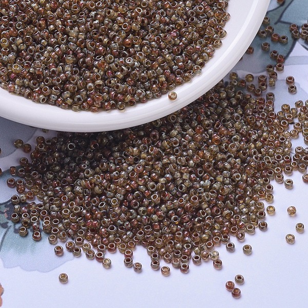 

PandaHall MIYUKI Round Rocailles Beads, Japanese Seed Beads, 11/0, (RR4505) Transparent Light Smoky Topaz Picasso, 11/0, 2x1.3mm, Hole..., Brown