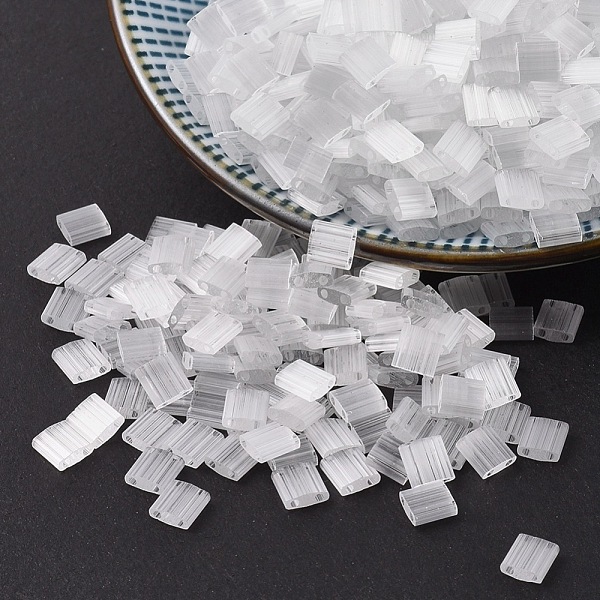 

PandaHall MIYUKI TILA Beads, Japanese Seed Beads, 2-Hole, (TL37) Crystal Silk Satin, 5x5x1.9mm, Hole: 0.8mm, about 118pcs/bottle, 10g/bottle..., Clear