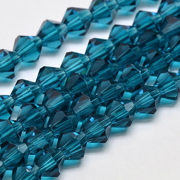 

PandaHall Transparent Glass Beads Strands, Faceted, Bicone, Steel Blue, 3.5x3mm, Hole: 0.8mm, about 113~115pcs/strand, 14.17~14.37 inch...