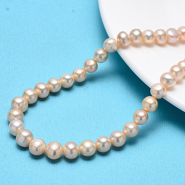 

PandaHall Natural Cultured Freshwater Pearl Beads Strands, Round, Pearl Pink, 8~9mm, Hole: 0.8mm, about 41~42pcs/strand, 14.17 inch(36cm)....
