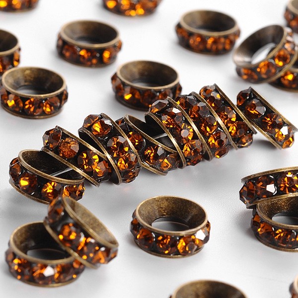 

PandaHall Brass Rhinestone Spacer Beads, Grade A, Rondelle, Antique Bronze Metal Color, Coffee, 10x4.2mm, Hole: 4.2mm Brass+Rhinestone..., Brown
