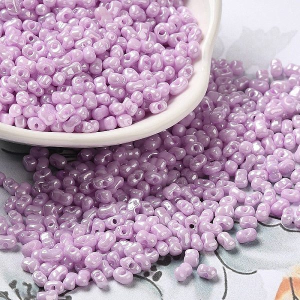 

PandaHall Glass Seed Beads, Peanut, Violet, 3.5~4x2~2.5x2~2.3mm, Hole: 0.8mm, about 8000pcs/pound Glass Peanut Purple