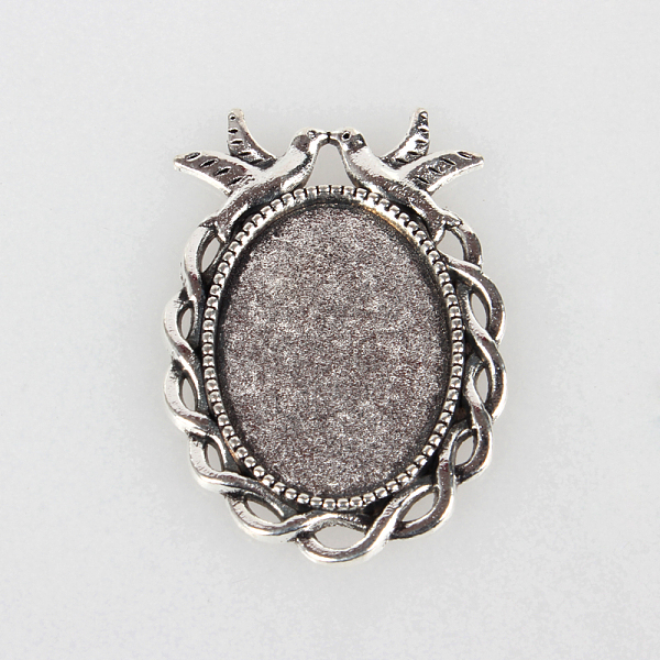 

PandaHall Tibetan Style Alloy Pendant Cabochon Settings, Cadmium Free & Lead Free, Oval with Birds, Antique Silver, Tray: 18x25mm, 38x27x2mm...