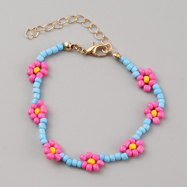 Bracciale con perline di fiori intrecciati in vetro e chiusura in lega dorata da donna