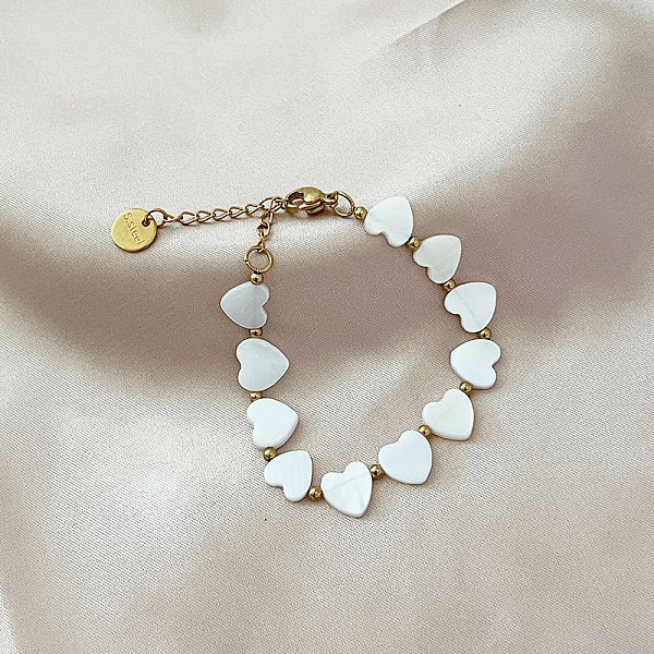 Bracciale Con Perle Di Conchiglia E Acciaio A Forma Di Cuore Dolce Per Le Donne