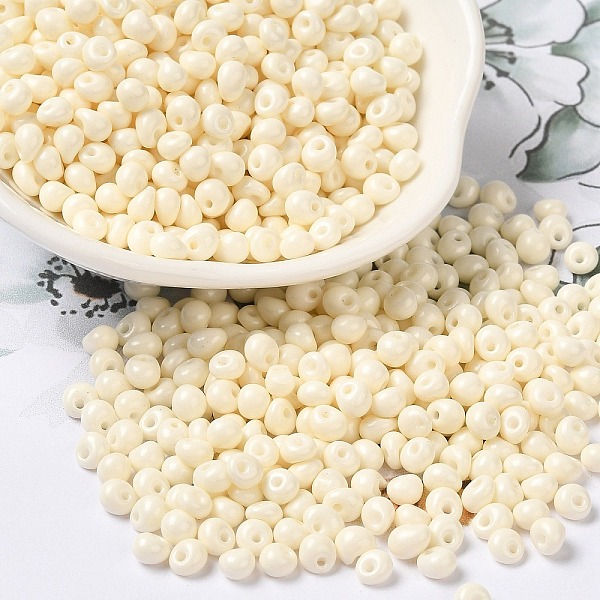 

PandaHall 6/0 Opaque Baking Paint Glass Seed Beads, Teardrop, Floral White, 4.5~5x4x3~3.5mm, Hole: 0.9mm, about 5625Pcs/Pound Glass Teardrop