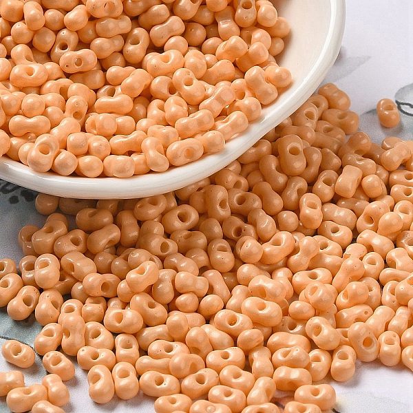 

PandaHall Baking Paint Glass Seed Beads, Peanut, Light Salmon, 5.5~6x3~3.5x3mm, Hole: 1~1.2mm, about 4000pcs/pound Glass Peanut