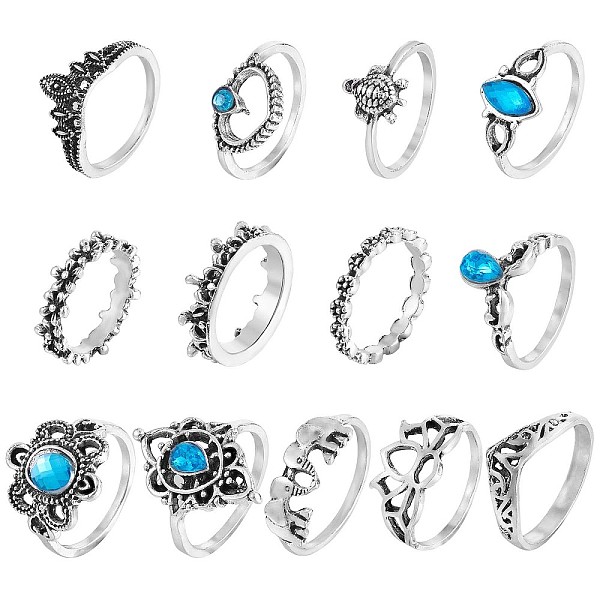 

PandaHall 13Pcs 13 Style Aquamarine Rhinestone Tortoise & Elephant & Lotus & Crown Finger Rings Set, Alloy Stackable Rings for Women..., Blue