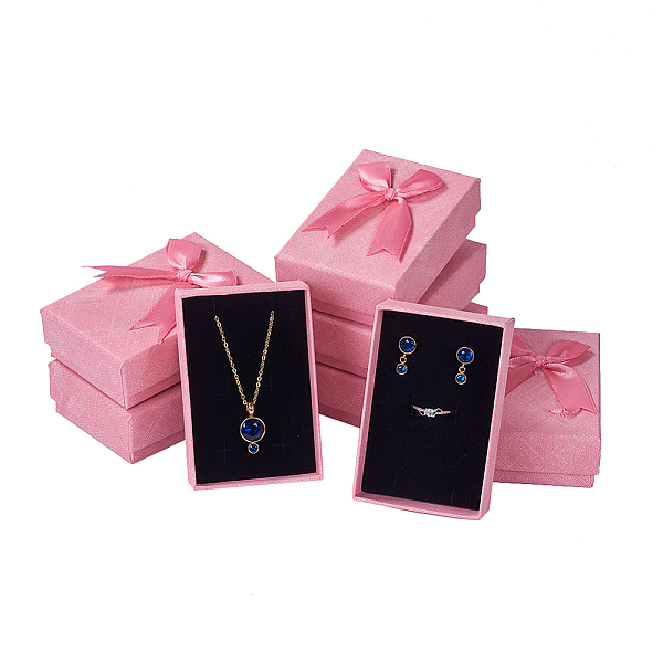 

PandaHall Cardboard Jewelry Boxes, with Ribbon Bowknot and Sponge, For Rings, Earrings, Necklaces, Rectangle, Pink, 9.3x6.3x3.05cm Paper...