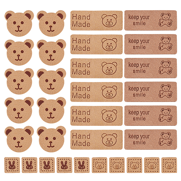 

PandaHall 80Pcs 4 Style Cartoon Style Bear Theme Faux Suede Fabric Clothing Label Tags, for DIY Jeans, Bags, Shoes, Hat Accessories, Peru..., Brown