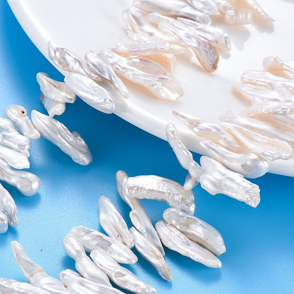 

PandaHall Natural Keshi Pearl Beads Strands, Cultured Freshwater Pearl, Chip, Seashell Color, 16~32x4~9x24mm, Hole: 0.6mm, about...