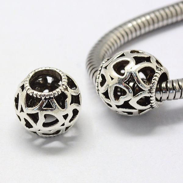 

PandaHall Alloy European Beads, Tibetan Style, Large Hole Beads, Rondelle with Heart, Hollow, Antique Silver, 11x11mm, Hole: 5mm Alloy...