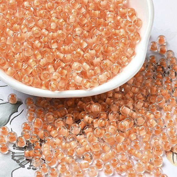 

PandaHall Transparent Glass Round Seed Beads, Inside Colours, Round, Saddle Brown, 6/0, 4x3mm, Hole: 1.2mm, about 7258pcs/pound Glass
