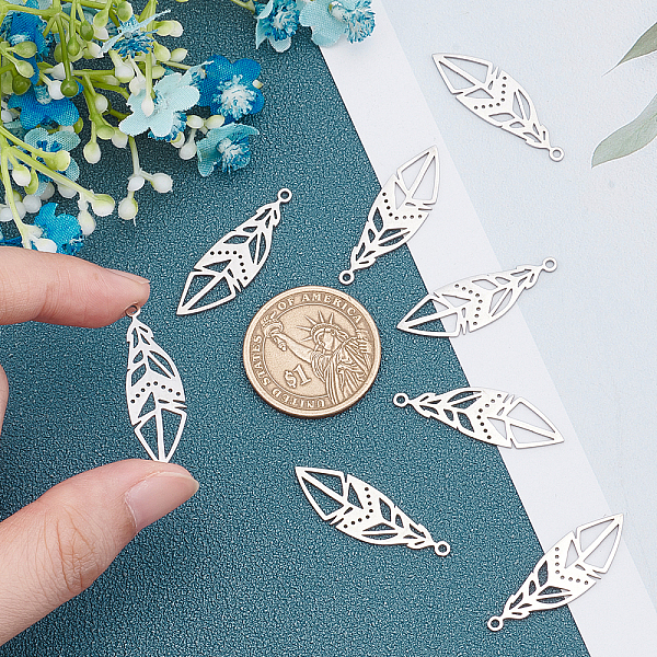 

PandaHall Unicraftale 201 Stainless Steel Pendants, Filigree Joiners Findings, Laser Cut, Feather, Stainless Steel Color, 33.5x10.5x1mm...