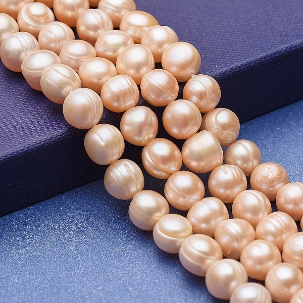 

PandaHall Natural Cultured Freshwater Pearl Beads Strands, Potato, Bisque, 9~11x9~10mm, Hole: 0.5mm, about 39pcs/strand, 14.76 inch(37.5cm)..., Orange