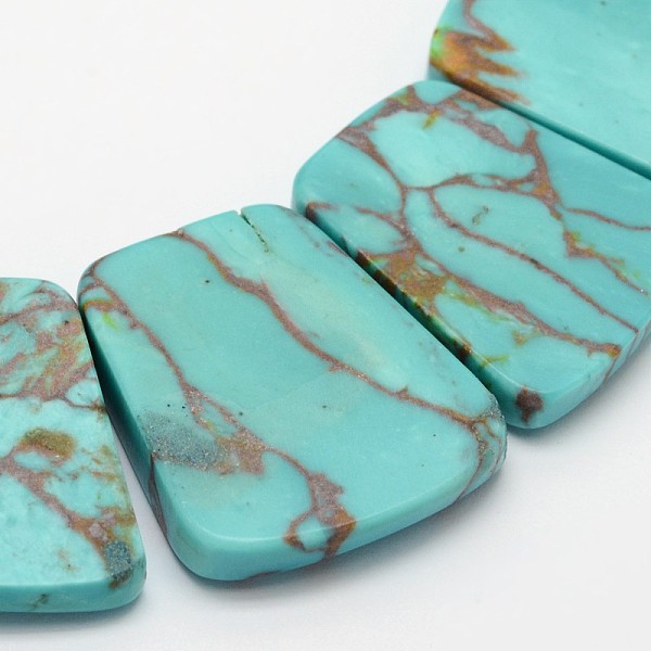

PandaHall Synthetic Turquoise Trapezoid Bead Strands, 16~35x24~29x6.5mm, Hole: 1.5mm, about 15pcs/strand, 11.81 inch Synthetic Turquoise...