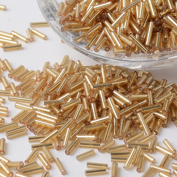 

PandaHall Silver Lined Glass Bugle Beads, Round Hole, Dark Goldenrod, 6~7x1.5~2mm, Hole: 0.5mm, about 12500pcs/bag Glass Gold