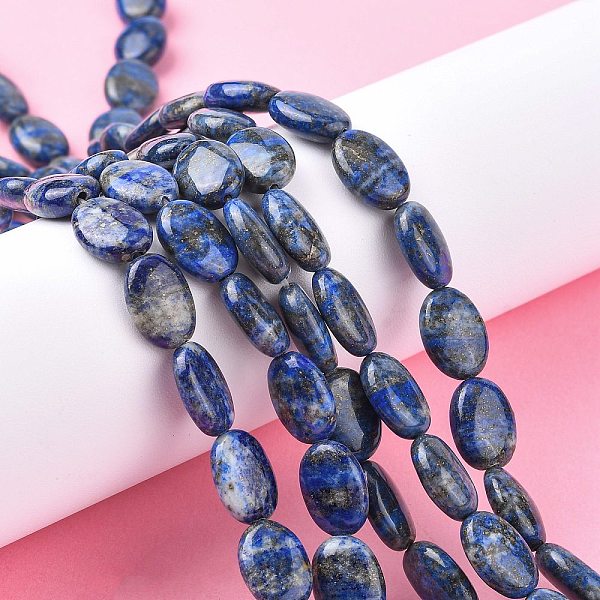 

PandaHall Natural Lapis Lazuli Beads Strands, Flat Oval, 14x10x4~5mm, Hole: 0.7mm, about 28~29pcs/strand, 15.35''~15.55'(39~39.5cm) Lapis...