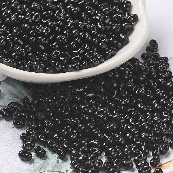 

PandaHall Opaque Glass Seed Beads, Peanut, Black, 3.5~4x2~2.5x2~2.3mm, Hole: 0.8mm, about 8000pcs/pound Glass Peanut Black