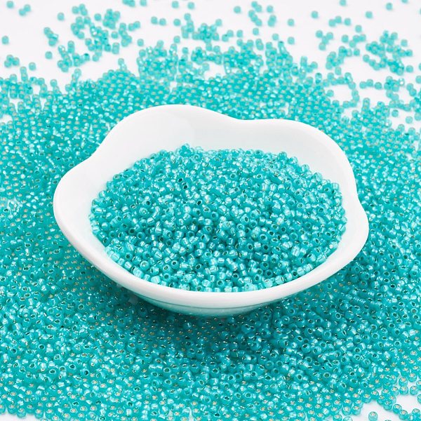 

PandaHall TOHO Japanese Seed Beads, Round, 11/0 , (2104) Silver Lined Milky Teal, 2x1.5mm, Hole: 0.5mm, about 42000pcs/pound Glass Green