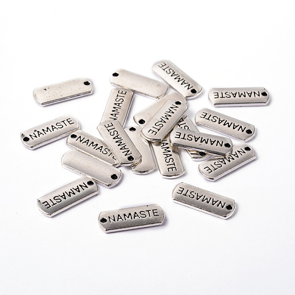 

PandaHall Tibetan Style Alloy Rectangle with Word Namaste Pendants, Cadmium Free & Lead Free, Antique Silver, 8x21x2mm, Hole: 2mm, about...