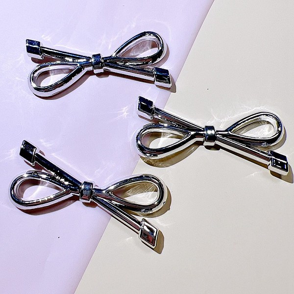 

PandaHall Bowknot Plastic Cabochons, DIY Hairpin Hair Accessories, Silver, 60x26mm Plastic Bowknot Silver
