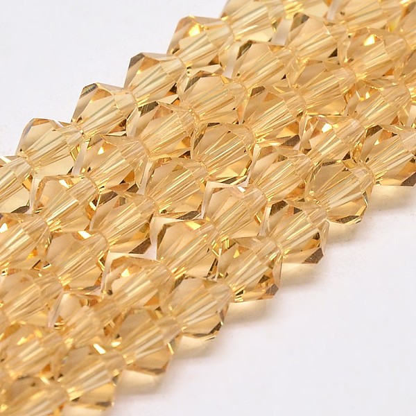 

PandaHall Transparent Glass Beads Strands, Faceted, Bicone, Goldenrod, 3.5x3mm, Hole: 0.8mm, about 113~115pcs/strand, 14.17~14.37 inch..., Gold