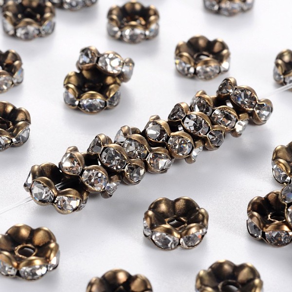 

PandaHall Brass Rhinestone Spacer Beads, Grade AAA, Wavy Edge, Nickel Free, Antique Bronze Metal Color, Rondelle, Crystal, 8x3.8mm, Hole..., Clear