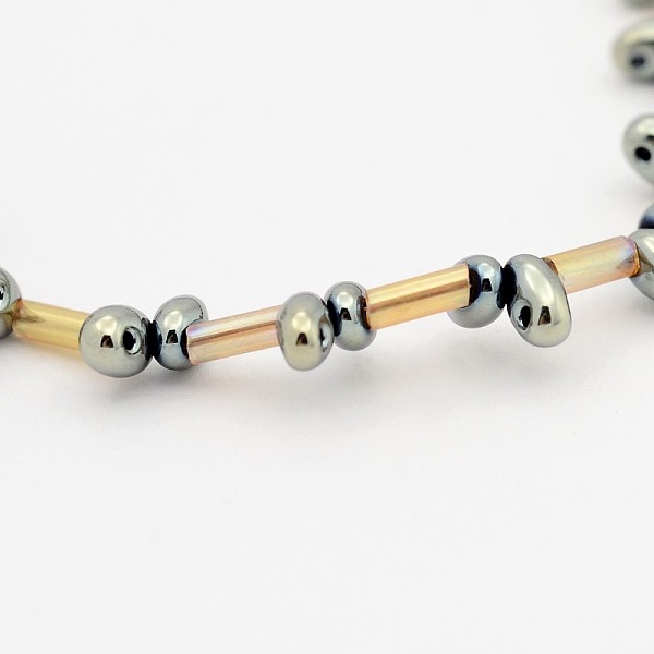 

PandaHall 2 Hole Electroplate Glass Oval Bead Strands, Full Plated, with Glass Bugle Beads, Golden Plated, 5x3mm, Hole: 1mm, about...