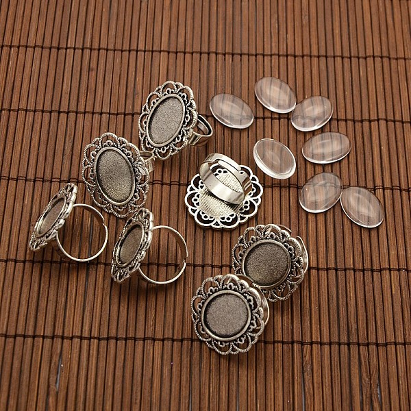 

PandaHall 13x18mm Oval Transparent Glass Cabochons and Iron Flower Finger Ring Components Alloy Cabochon Bezel Settings for DIY, Antique..., Clear