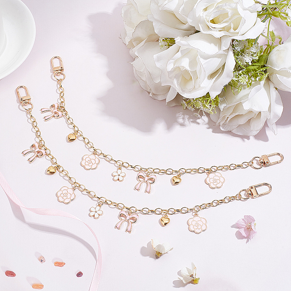 

PandaHall WADORN 2Pcs Brass Cable Chains Bag Strap Extender, with Alloy Enamel Flower Pendants, Alloy Heart Charms & Swivel Clasps, Bowknot...