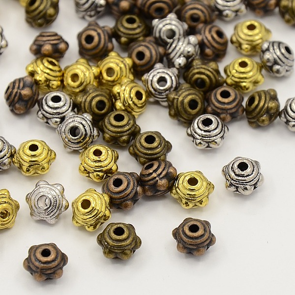 

PandaHall Mixed Tibetan Style Alloy Flower Spacer Beads, Cadmium Free & Lead Free, Mixed Color, 7x5.5mm, Hole: 1mm, about 360pcs/200g Alloy...