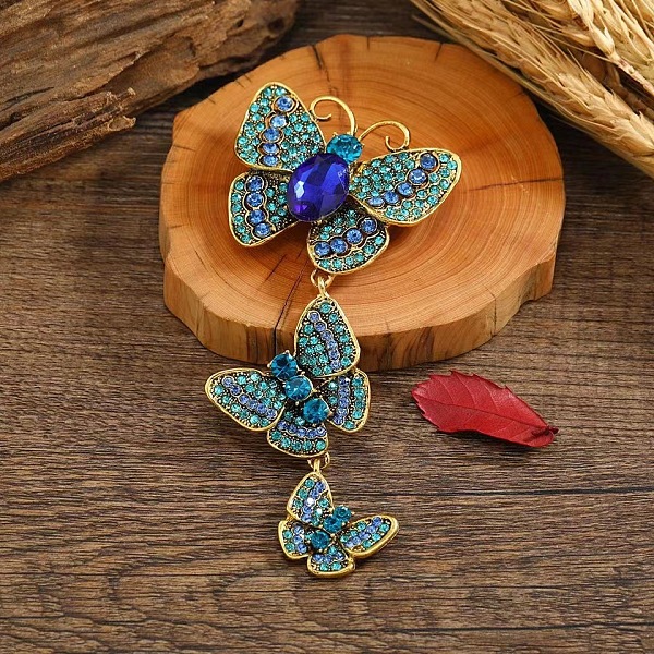 

PandaHall Creative Long Alloy Triple Butterfly Brooch, Rhinestone Retro Insect Brooch, for Ceremony Banquet Suit Accessory, Sapphire..., Blue
