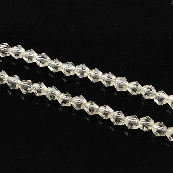 

PandaHall Electroplate Glass Bead Strands, Rainbow Plated, Faceted Bicone, Clear, 4x4.5mm, Hole: 1mm, 92~96pcs/strand, 13.78~14.37 inch...