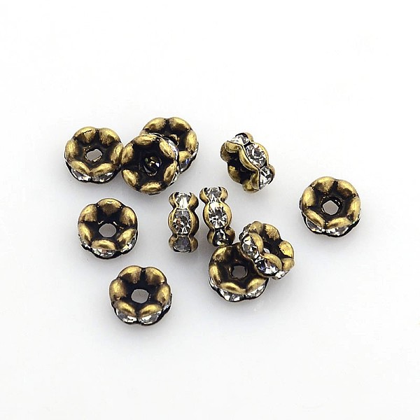 

PandaHall Brass Rhinestone Spacer Beads, Grade AAA, Wavy Edge, Nickel Free, Antique Bronze, Rondelle, Crystal, 6x3mm, Hole: 1mm..., Clear