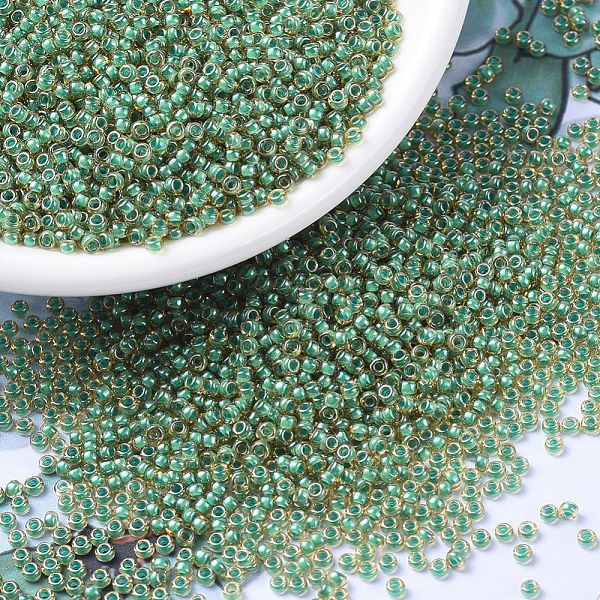 

PandaHall MIYUKI Round Rocailles Beads, Japanese Seed Beads, (RR374) Turquoise Lined Light Topaz Luster, 11/0, 2x1.3mm, Hole: 0.8mm, about..., Brown