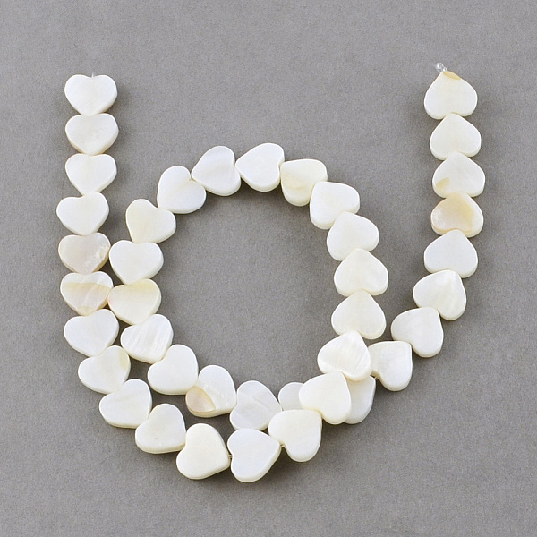 

PandaHall Natural Sea Shell Beads Strands, Heart, Creamy White, 10x10~11x3mm, Hole: 0.8~0.9mm, about 40pcs/strand, 14.1 inch Other Sea Shell...