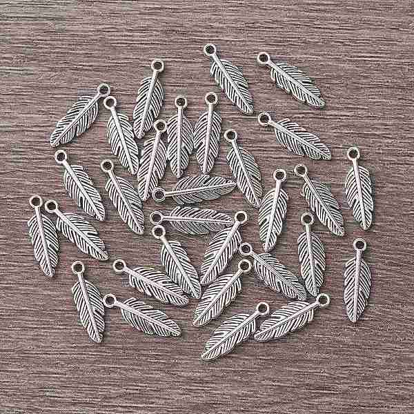 

PandaHall Tibetan Style Alloy Pendants, Feather, Antique Silver, 15x5x1.5mm, Hole: 1mm. Alloy Feather