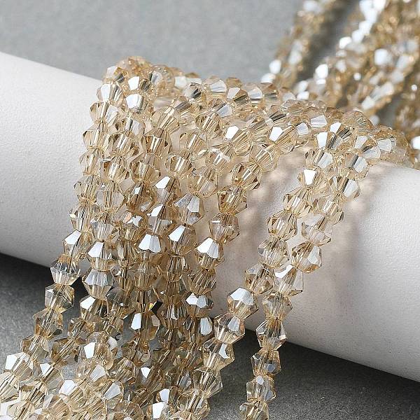 

PandaHall Electroplate Glass Bead Strands, Rainbow Plated, Faceted Bicone, Clear, 3x3.5mm, Hole: 1mm, about 125~130pcs/strand, 18 inch Glass...