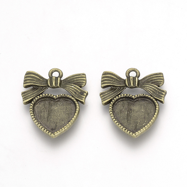 

PandaHall Tibetan Style Alloy Pendant Cabochon Settings, Bowknot with Heart, Antique Bronze, Tray: 11x12mm, 23x19x2mm, Hole: 2mm Alloy...