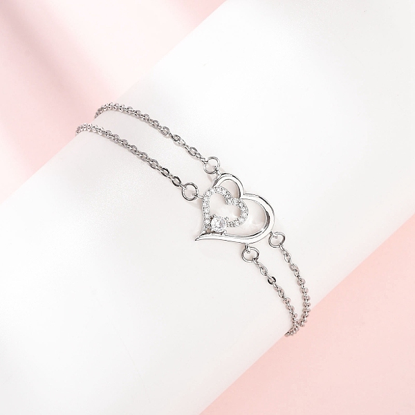 Bracelet double rang en laiton serti de micro-pavés de zircon cubique transparent.